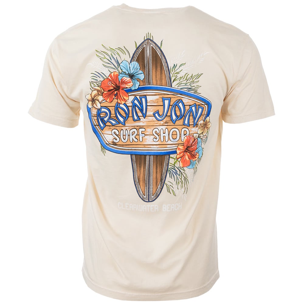 Back of a beige T-shirt featuring Ron Jon Surf Shop and Clearwater Beach text with a surfboard and floral design.