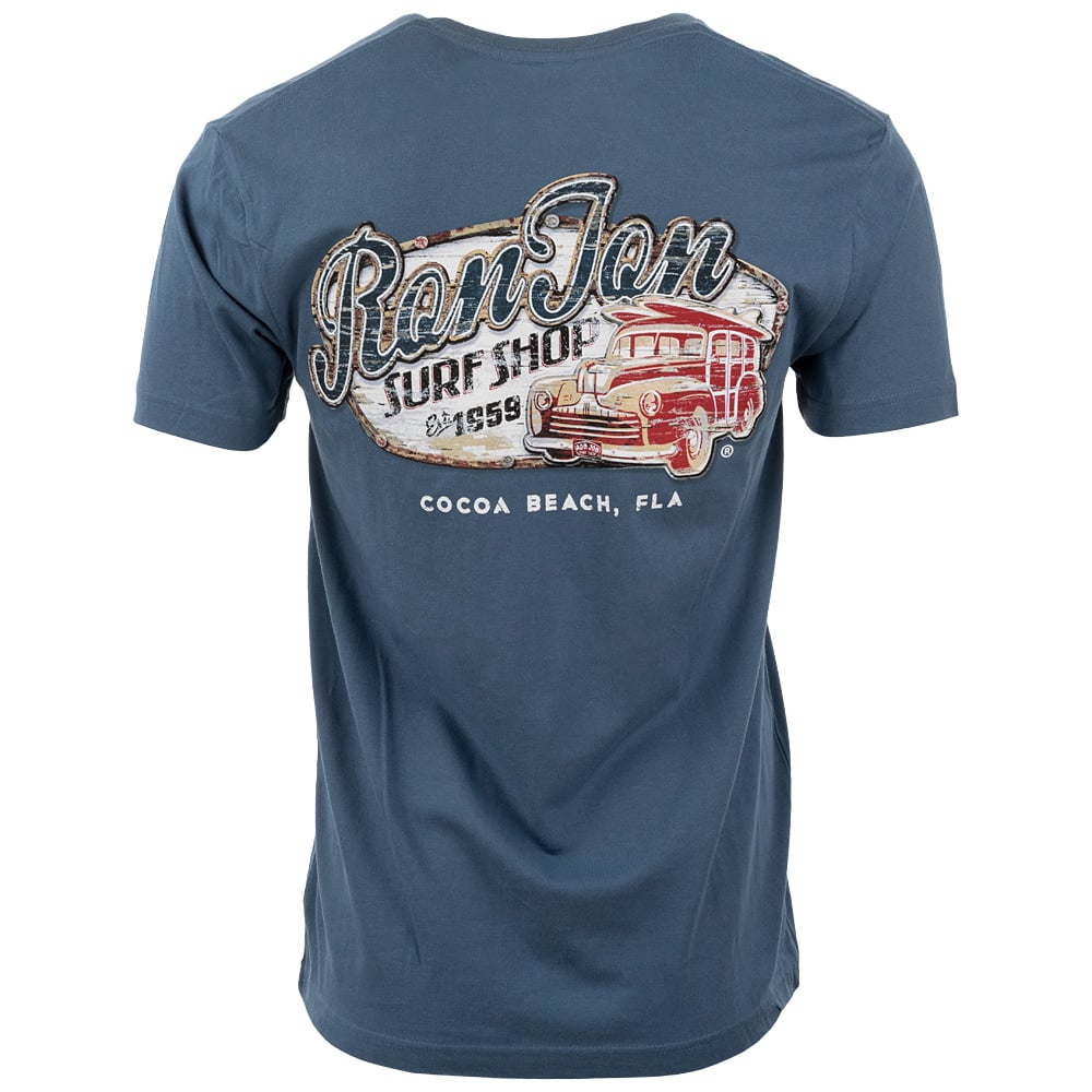 Back view of a blue t-shirt featuring Ron Jon Surf Shop text, a vintage car graphic, and Cocoa Beach, Fla printed on the back.