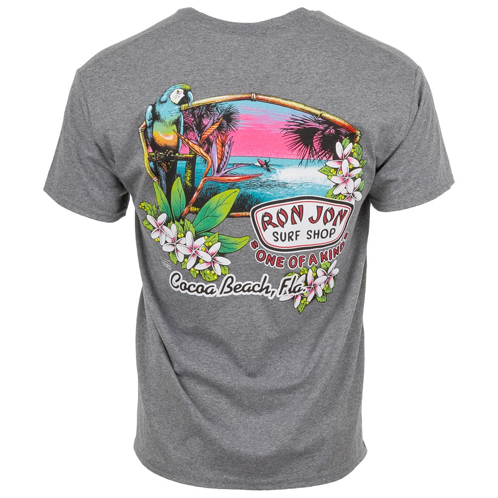 Back of a grey T-shirt featuring a colorful tropical design with a parrot, flowers, palm trees, and the text “Ron Jon Surf Shop, One of a Kind, Cocoa Beach, Florida.”.