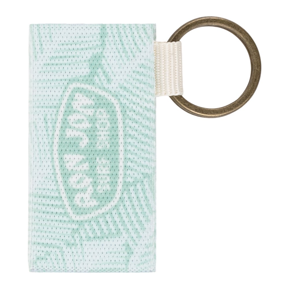 A rectangular fabric keychain with a green abstract pattern, featuring a white loop and a large brass keyring attached on the right side.