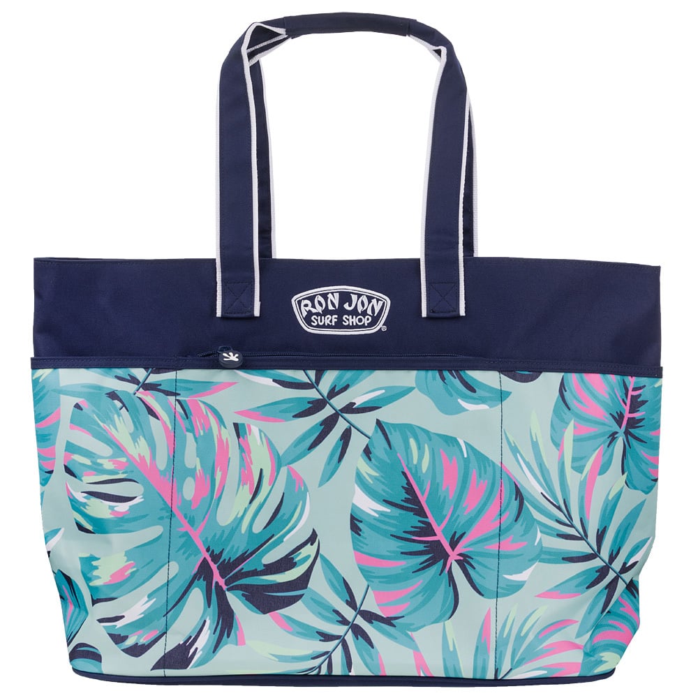 Tote bag with navy handles and top, featuring colorful tropical leaf patterns and a Ron Jon Surf Shop logo patch on the front.