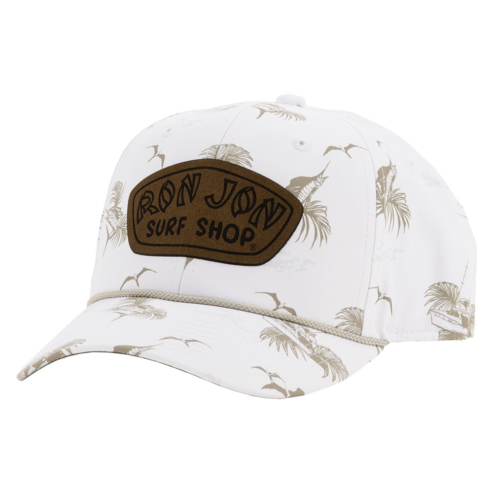 White baseball cap with brown Ron Jon Surf Shop patch on front. Features a beige palm frond and fish pattern.
