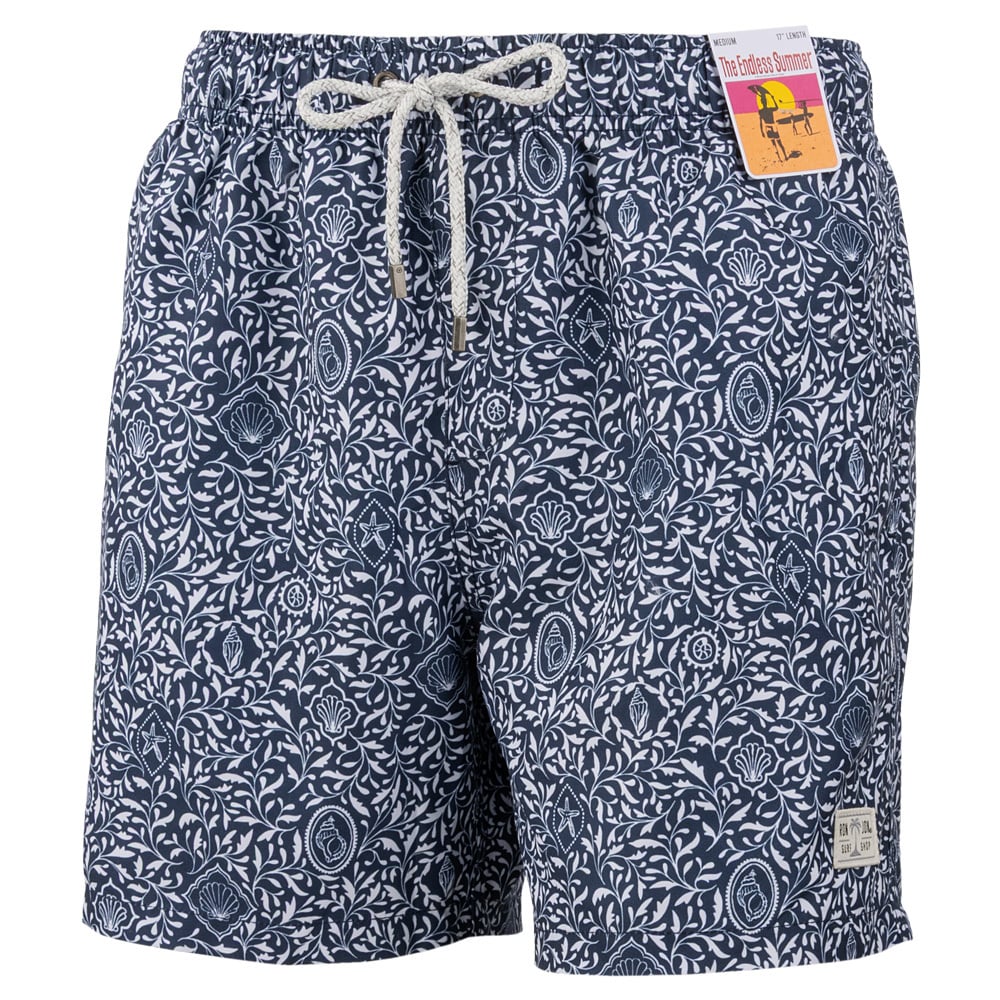 Navy blue swim shorts with a white floral pattern, drawstring waist, and a small label on the leg. A product tag is attached near the waistband.