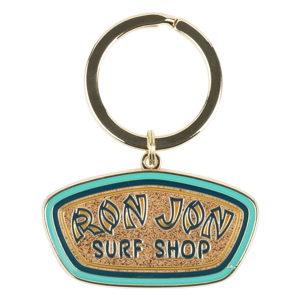 A keychain with a metal ring and a sign that reads Ron Jon Surf Shop in stylized letters on enamel resembling sand, bordered by blue and green.