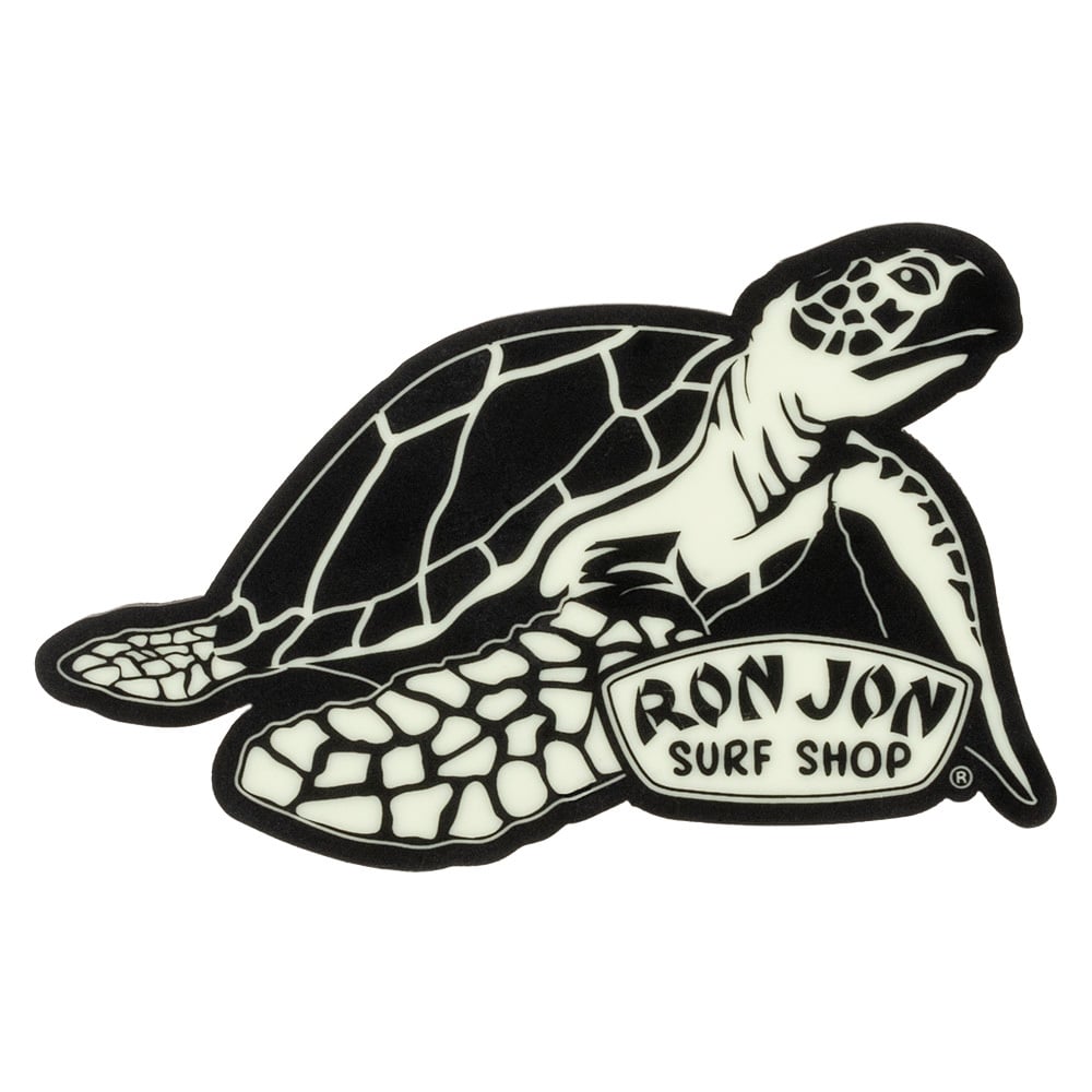 Black and white magnet of a sea turtle with the text Ron Jon Surf Shop on its front flipper.