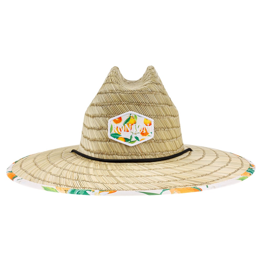 A straw sun hat with a wide brim, featuring a colorful patch with Ron Jon Surf Shop and floral patterns. The underside of the brim has a tropical fruit print.