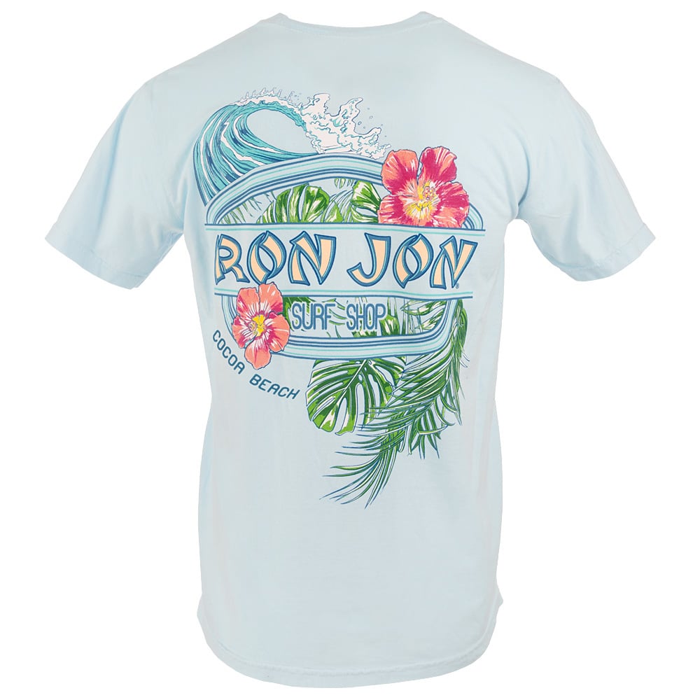 Light blue T-shirt featuring a graphic of a wave, tropical flowers, and leaves with the text “Ron Jon Surf Shop Cocoa Beach” on the back.