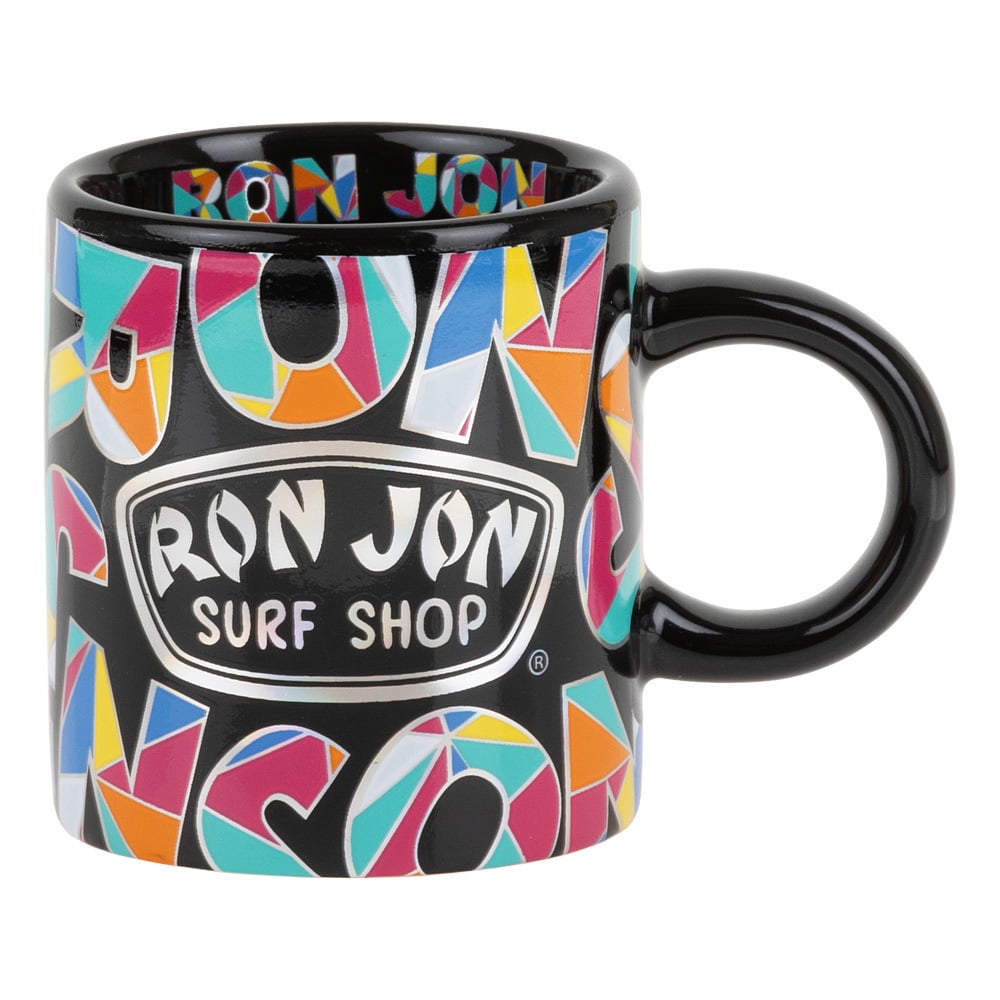 A black mug with colorful geometric patterns and the text Ron Jon Surf Shop printed on the front.