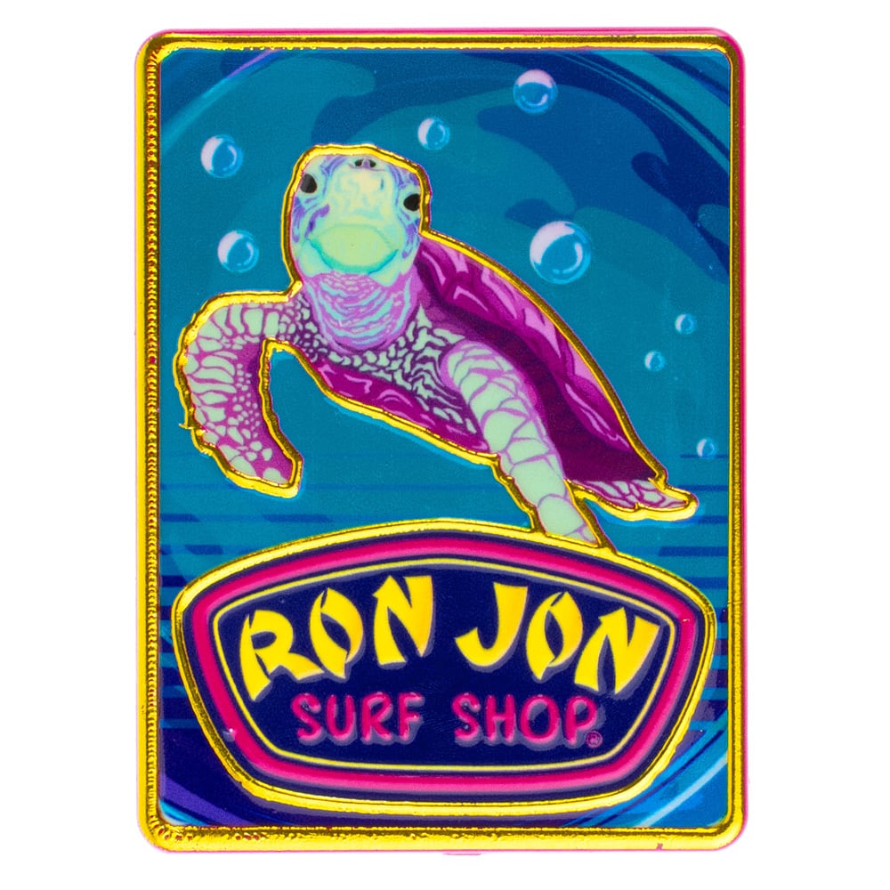 A colorful magnet featuring a sea turtle swimming above a Ron Jon Surf Shop sign on a blue ocean background.