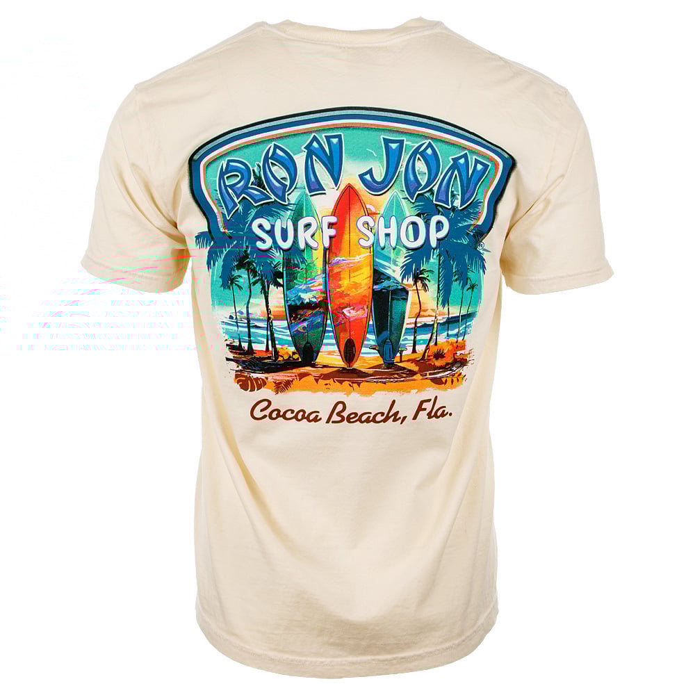 Beige T-shirt featuring Ron Jon Surf Shop logo, surfboards, and palm trees with Cocoa Beach, Fla. text on the back.