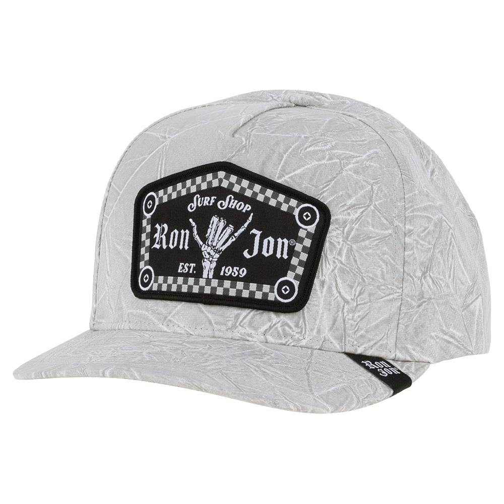 A gray crinkled-looking fabric cap with a black and white Ron Jon Surf Shop patch on the front and EST. 1959 text.