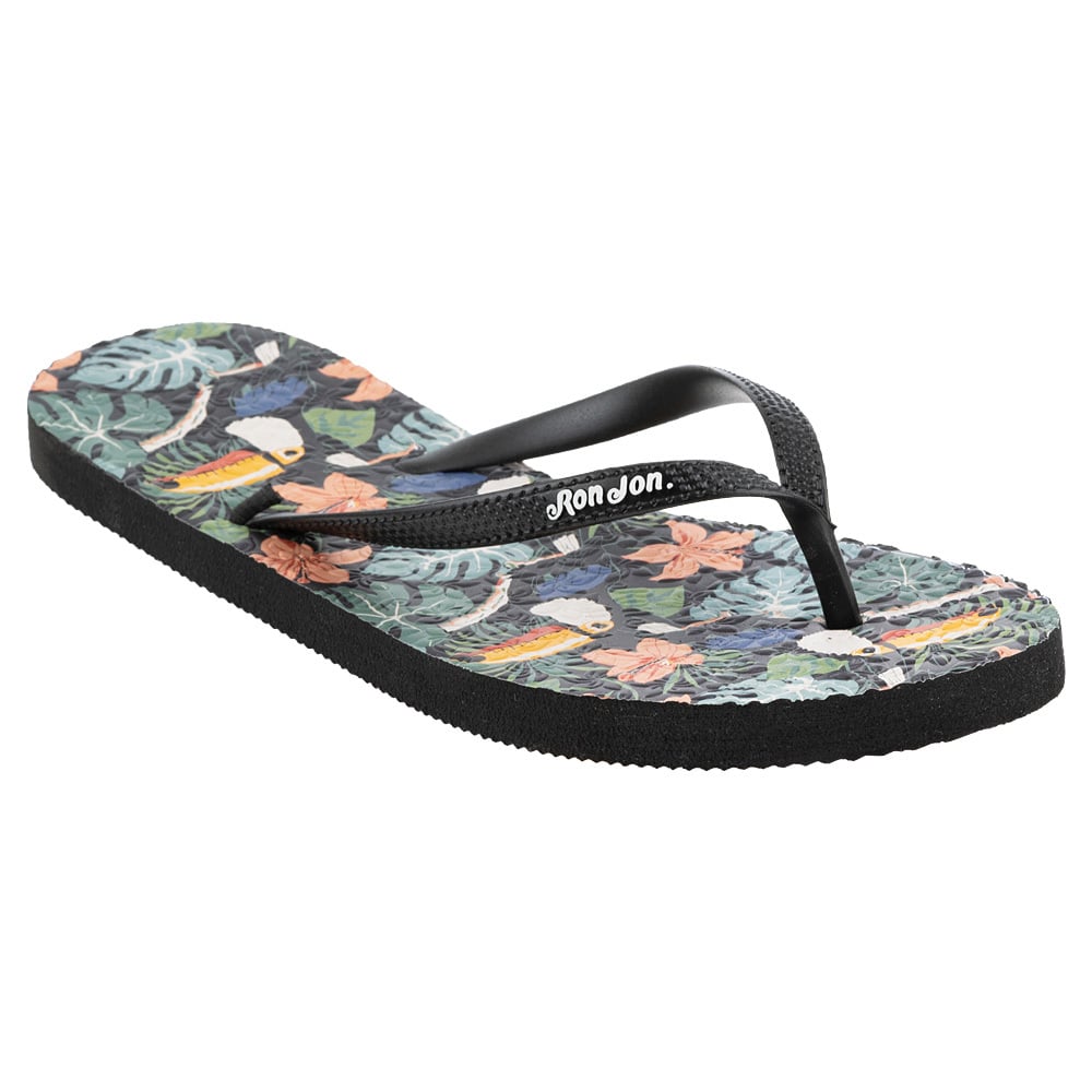 Black flip-flop with a tropical bird and foliage pattern on the footbed. The brand name is printed on the strap.