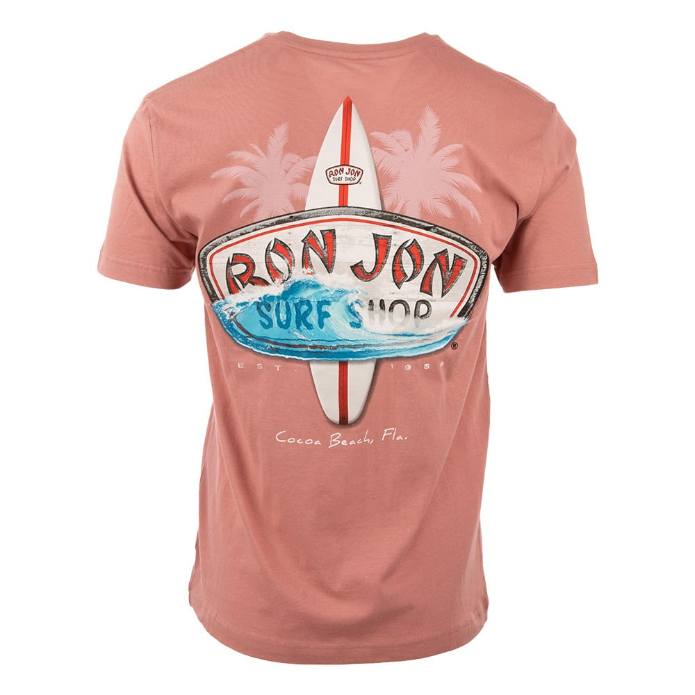 Back of a pink T-shirt featuring a Ron Jon Surf Shop logo with a surfboard and wave design. Text: Cocoa Beach, Fla.