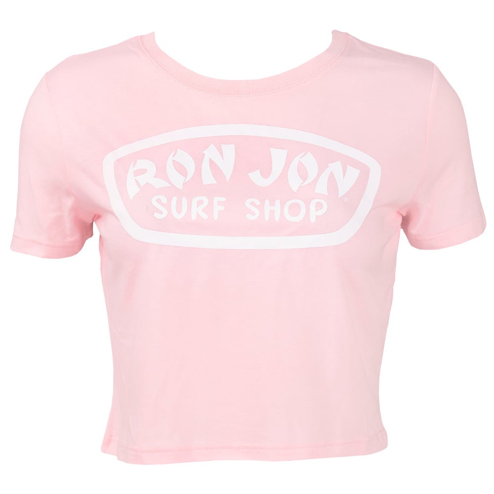 A light pink cropped t-shirt with Ron Jon Surf Shop printed in white on the front.