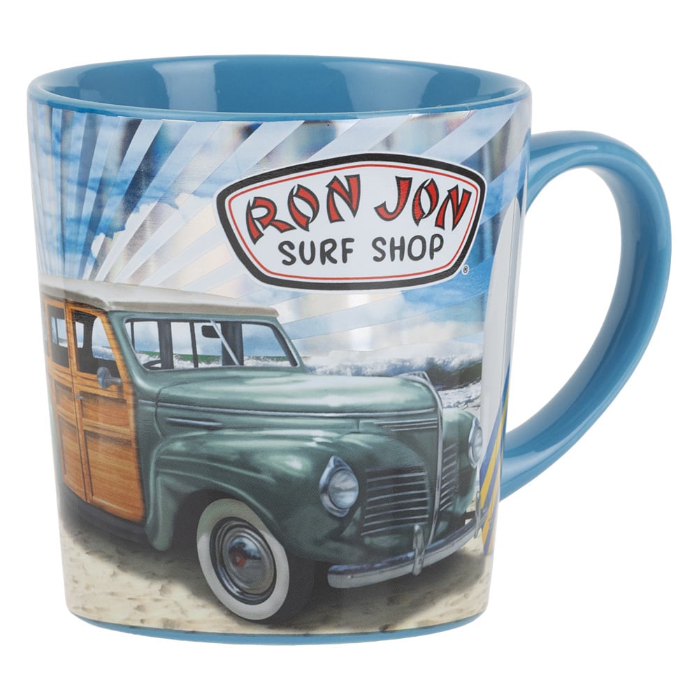 Blue ceramic mug featuring a vintage car on a beach with the Ron Jon Surf Shop logo in red and black on a white sign background.