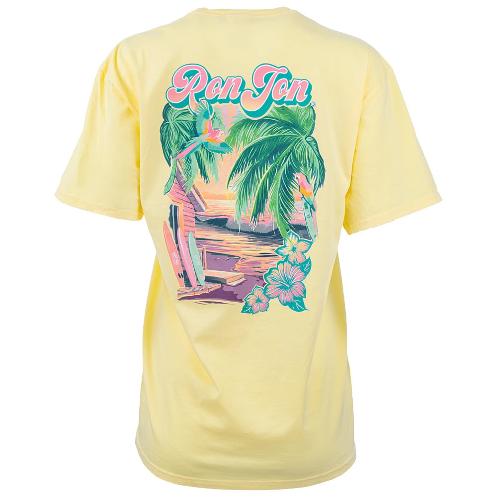 Yellow T-shirt with a colorful beach scene, surfboards, palm trees, flowers, and the text Ron Jon printed on the back.