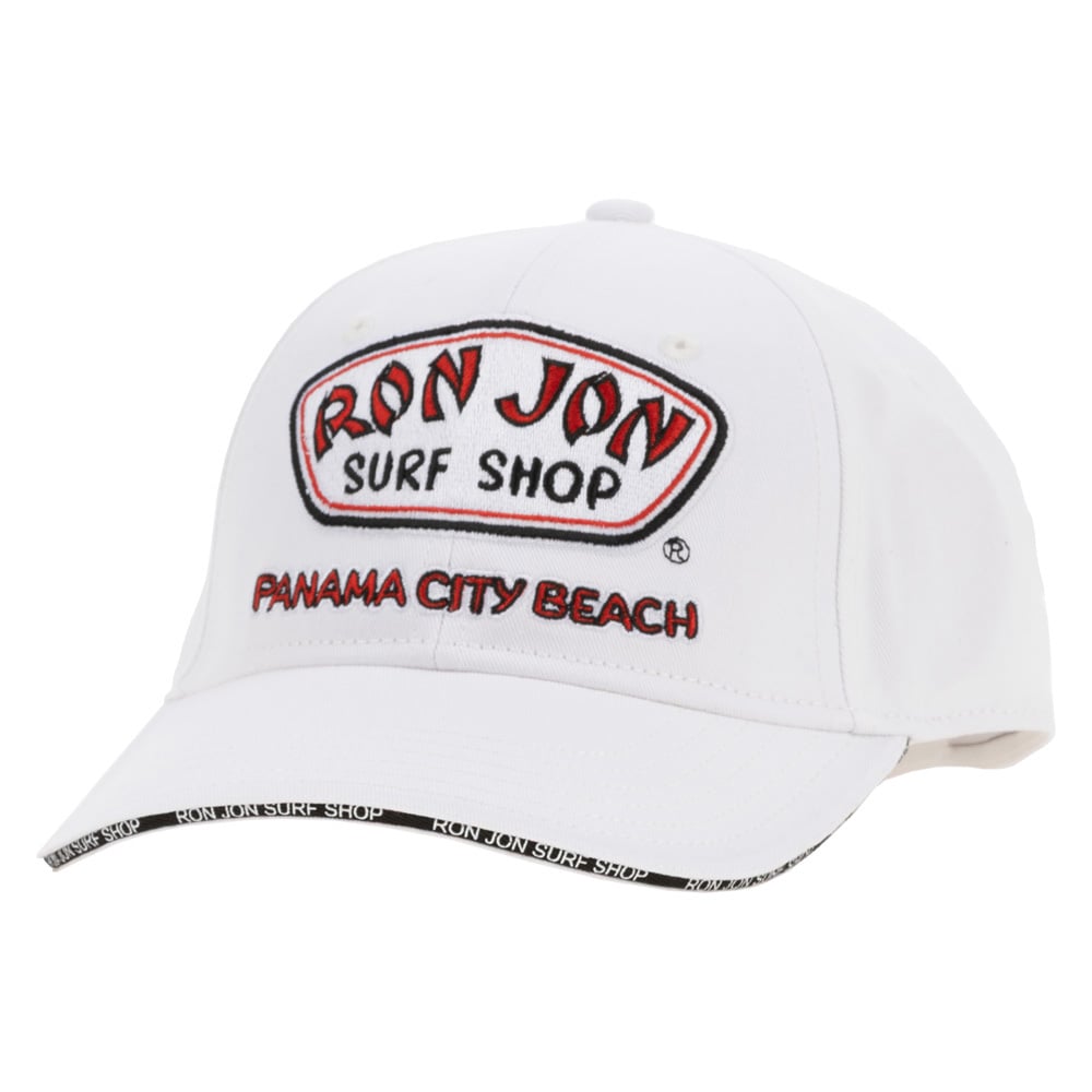 White baseball cap with Ron Jon Surf Shop and Panama City Beach embroidered on the front; black text on the brim edge.