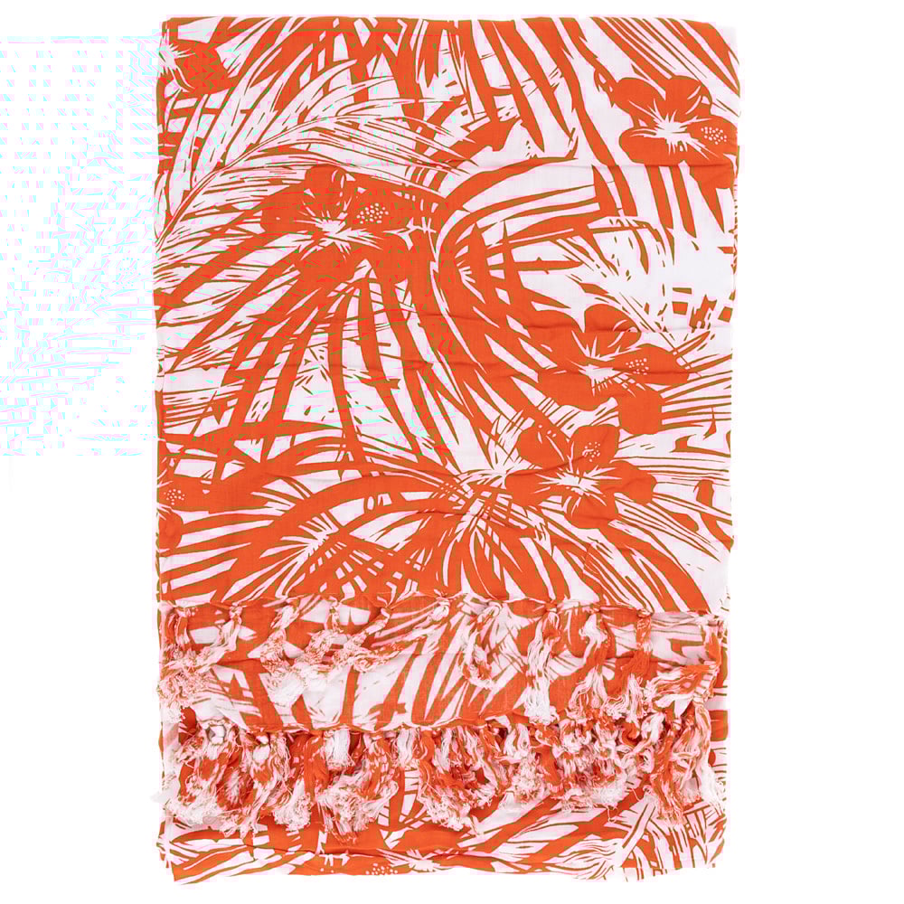 Orange and white sarong with a tropical leaf pattern and fringed edges.