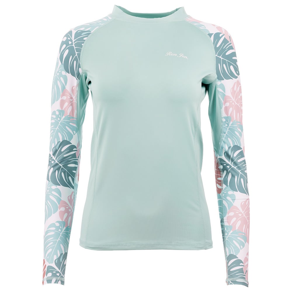 A light green long-sleeve rash guard with tropical leaf-patterned sleeves in shades of pink and green.
